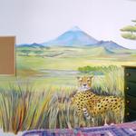 This cheetah's eyes follow you around the room as he relaxes is a space enhancing African Grasslands mural. 
©2001 Kristen Muench
photo by David A. Harvey